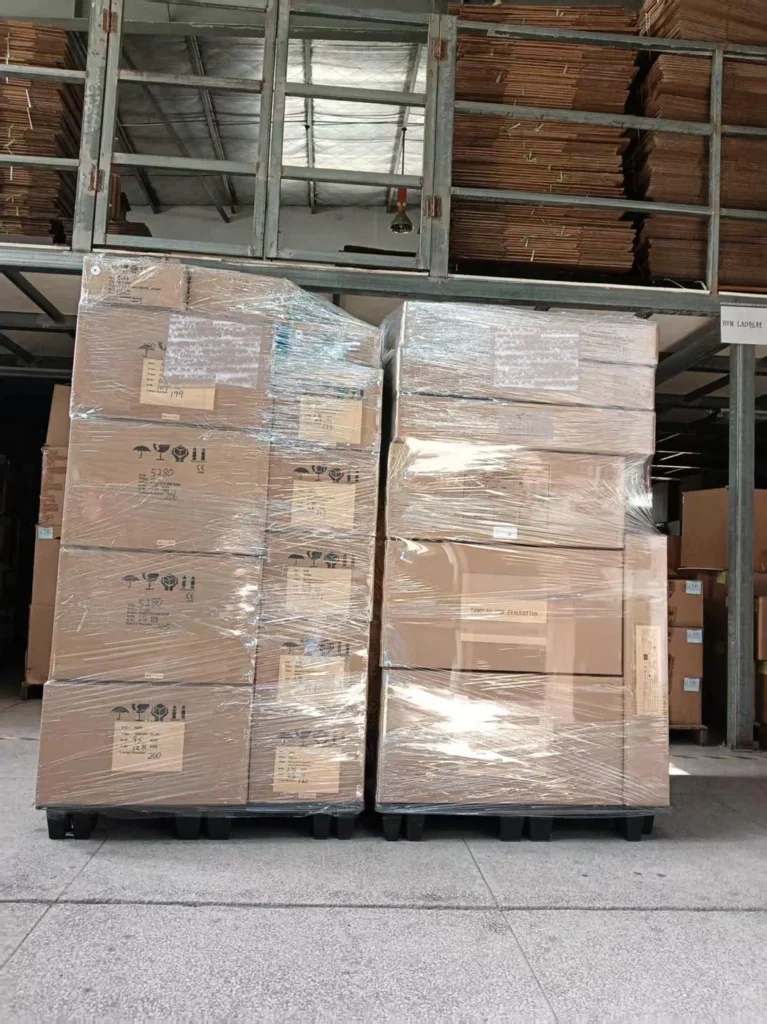 Pallets of cardboard boxes, shrink wrapped for shipping from China to UK