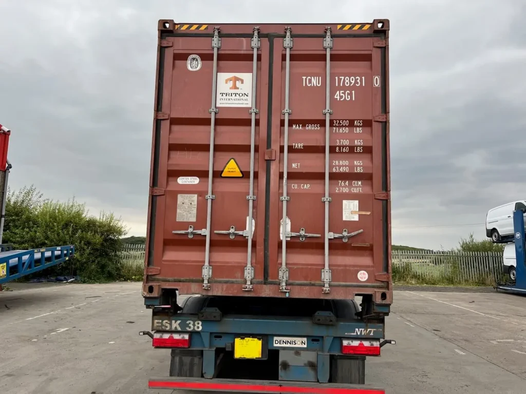 Rear view of Shipping Containers from Japan with doors closed displaying marks and numbers