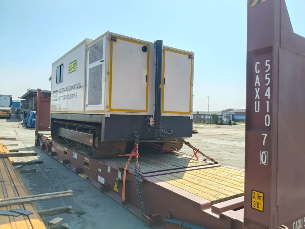 Machinery lashed and loaded on a 40' flat rack from South Africa shipping to the UK