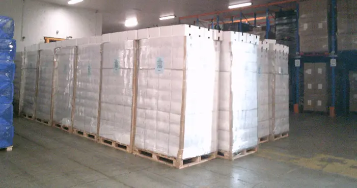 Pallets lined up in a warehouse, devanned from a reefer shipping from China shipment