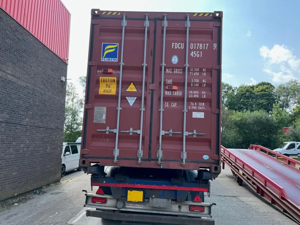 Shipping Container from Japan loaded on the back of a trailer for delivery in the UK