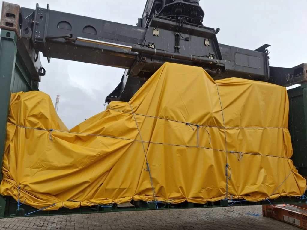 Machinery loaded on a 20' flat rack container ready for shipping to the US